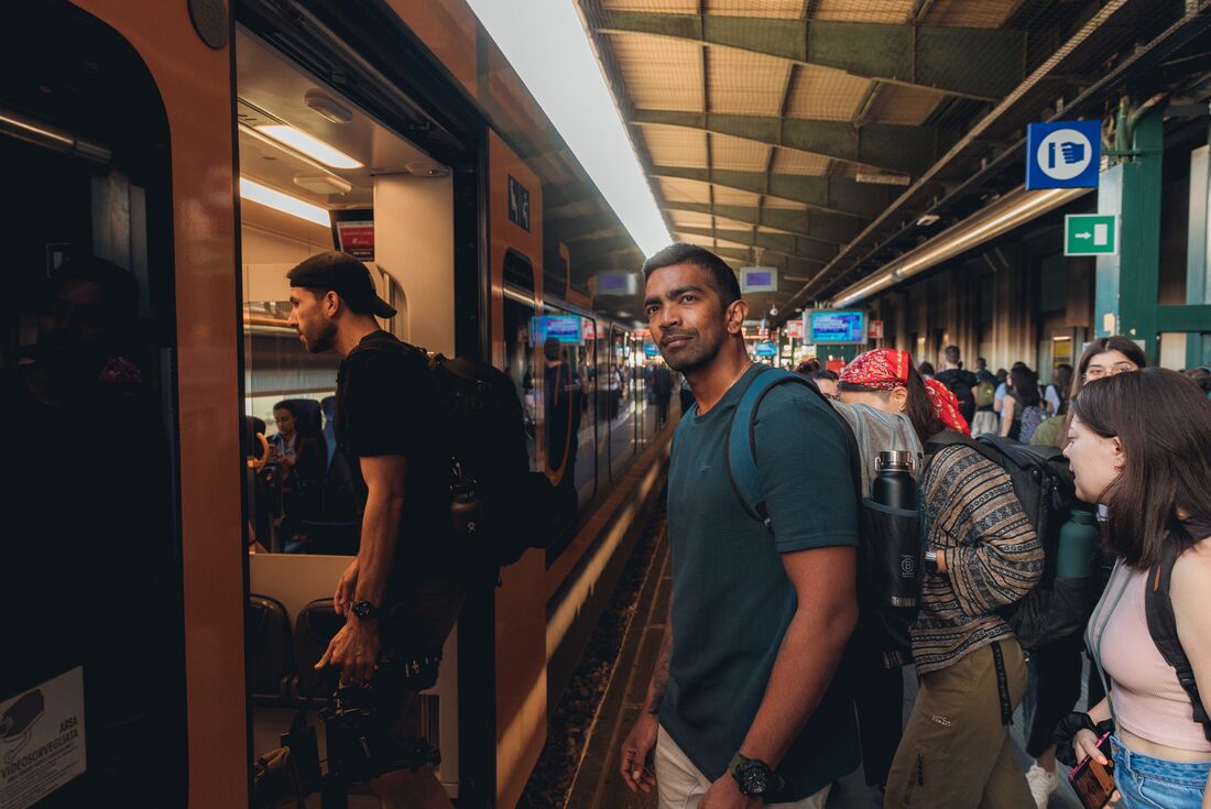 Intrepid travellers board their train in an Italian station