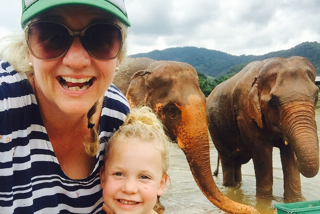 Mother and daughter pose for a photo at Chiang Mai elephant sanctuary