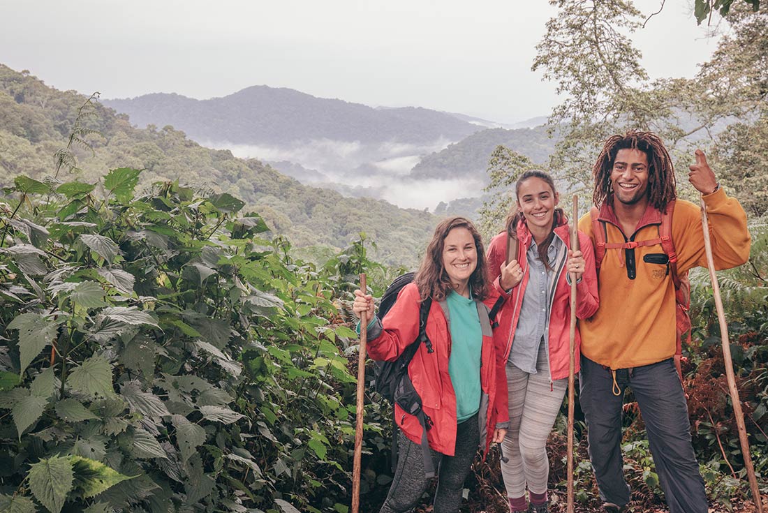 YGPU - Intrepid Travel - Uganda Gorilla trek - Group of hikers standing on cliff