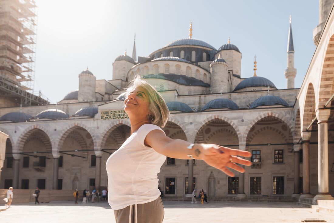 Traveller enjoying her time at the Blue Mosque in Istanbul, Turkey