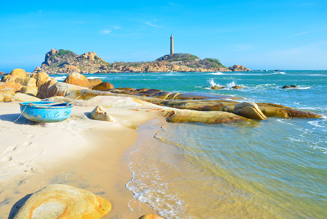 Coastal view of the famous Ka Ga lighthouse and beach, Vietnam along an Intrepid Travel tour