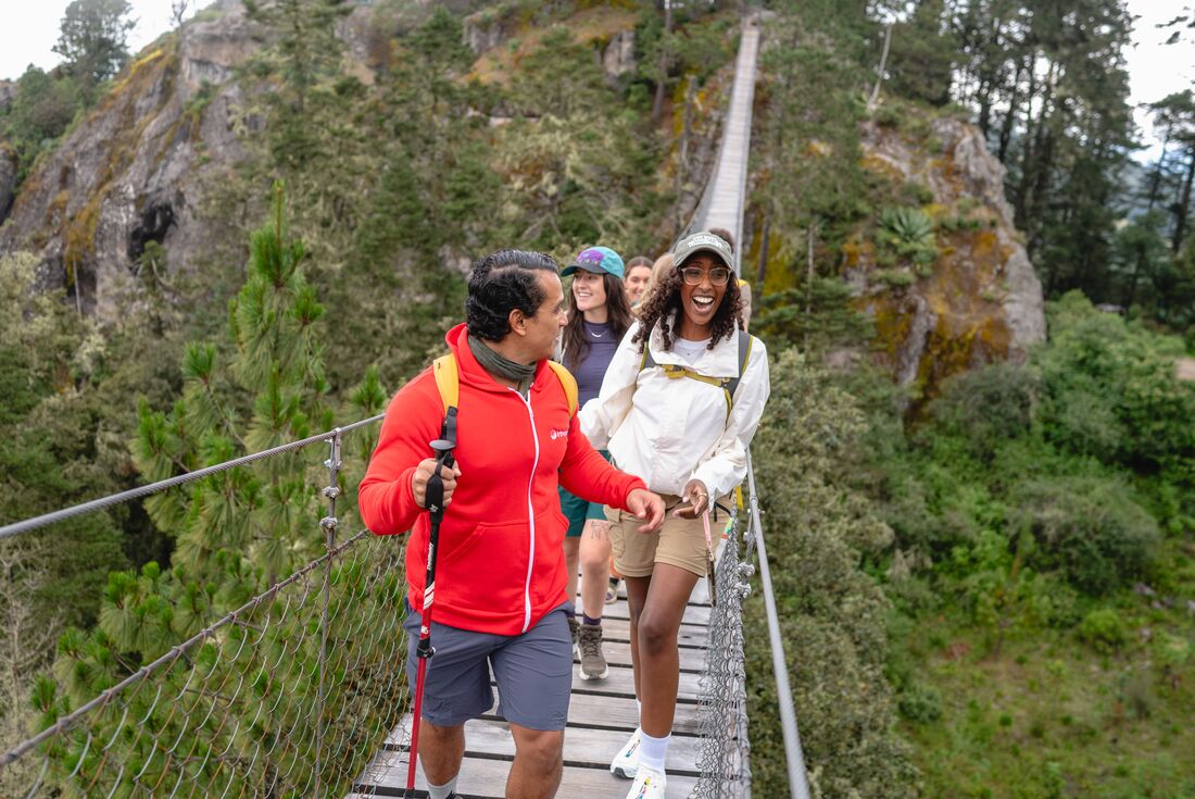 Take in the incredible views on Benito Juarez hanging bridge with Intrepid Travel tour group