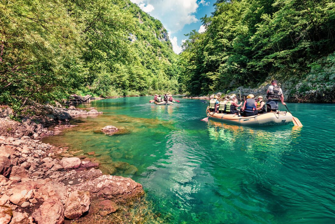 View from the shore as travellers set off to whitewater raft in Tara Canyon, Durmitor National Park in Montenegro