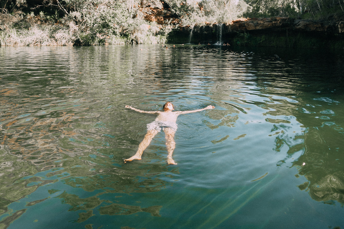 Intrepid traveller floating peacefully in a waterhole in Karijini National Park
