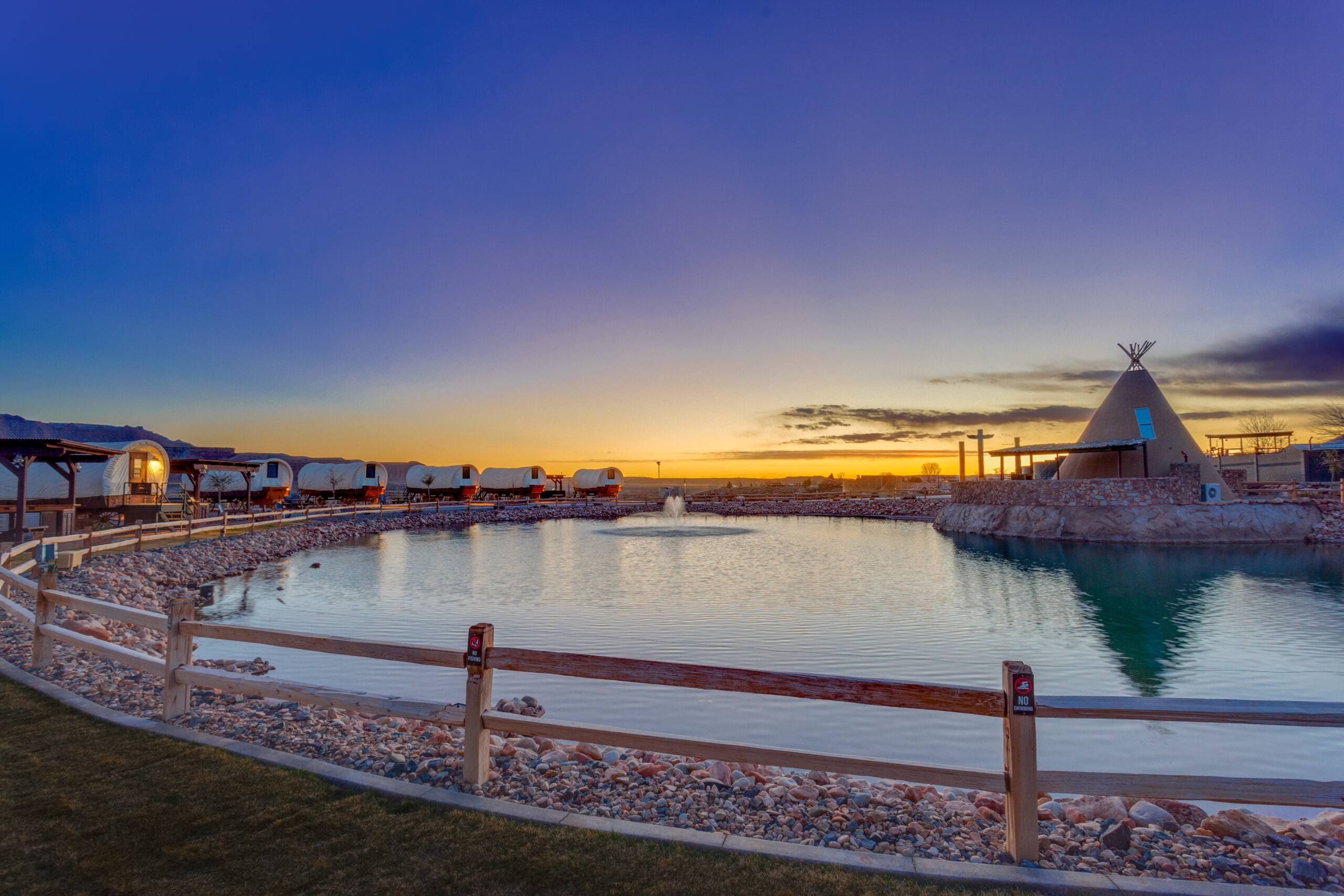 A sunset view of the conestoga wagon glamping tents near Zion National Park, USA