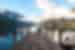 Travellers sit at the end of a pier on Lake Rotoiti in Nelson Lakes National Park in New Zealand