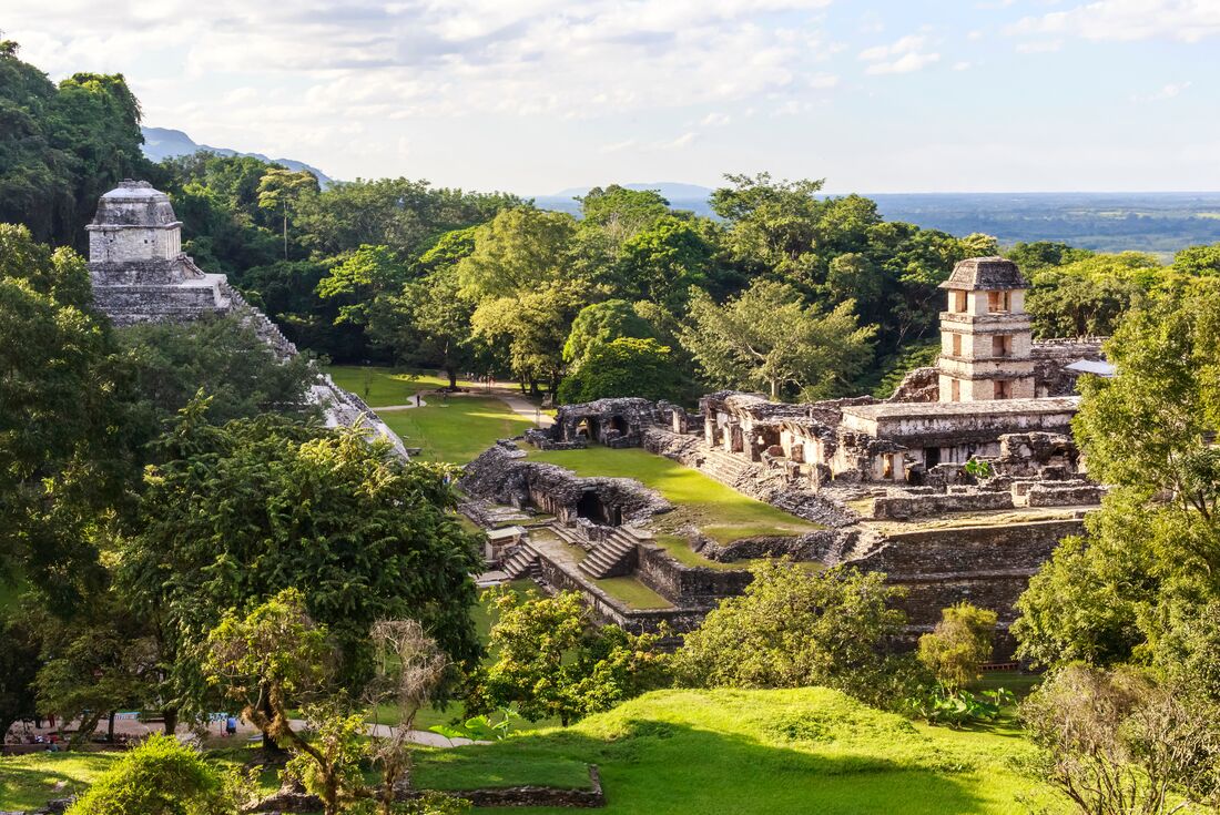 Ziggurat Mayan Ruins Temple on a sunny day with clouds in Palenque, Mexico