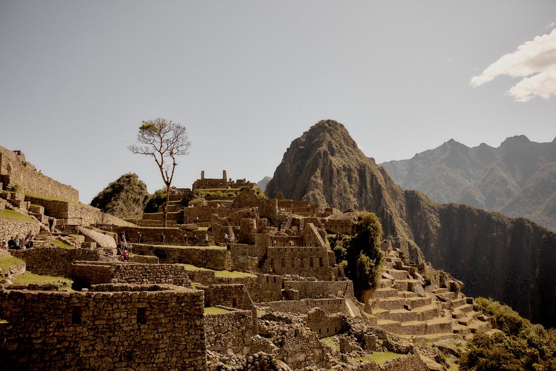 Travellers exploring the ruins of Machu Picchu