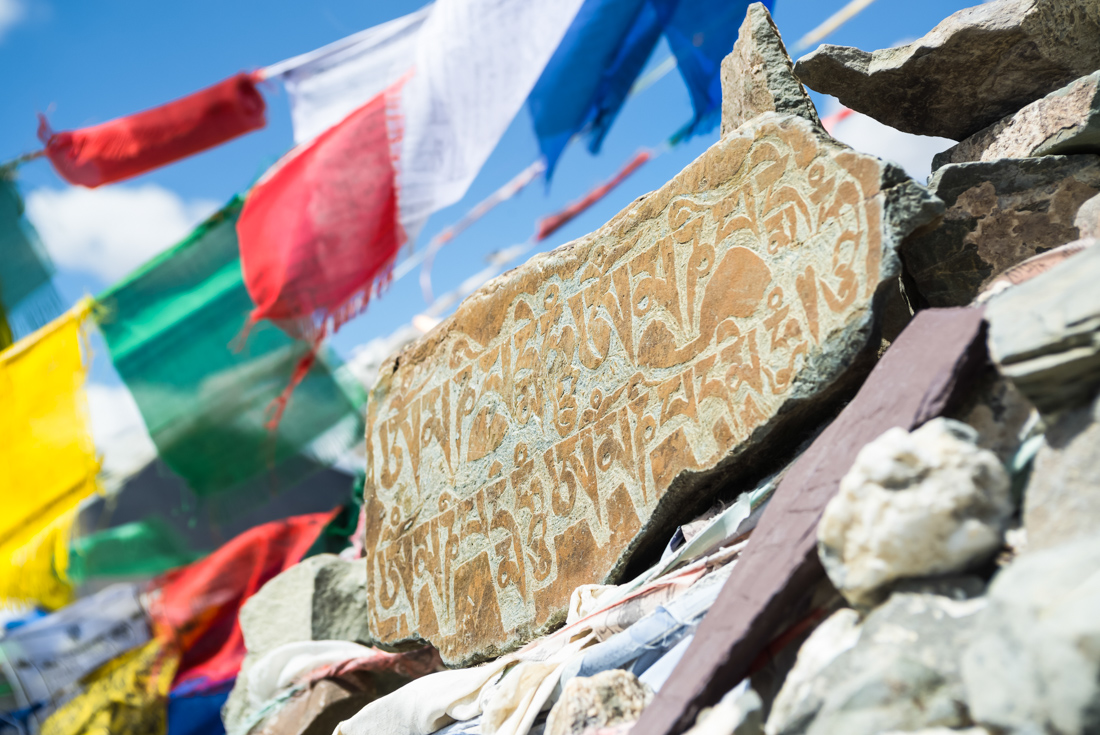Mani stone with sanskrit prayer inscription at Ganda La Pass on the Markha Valley Trek