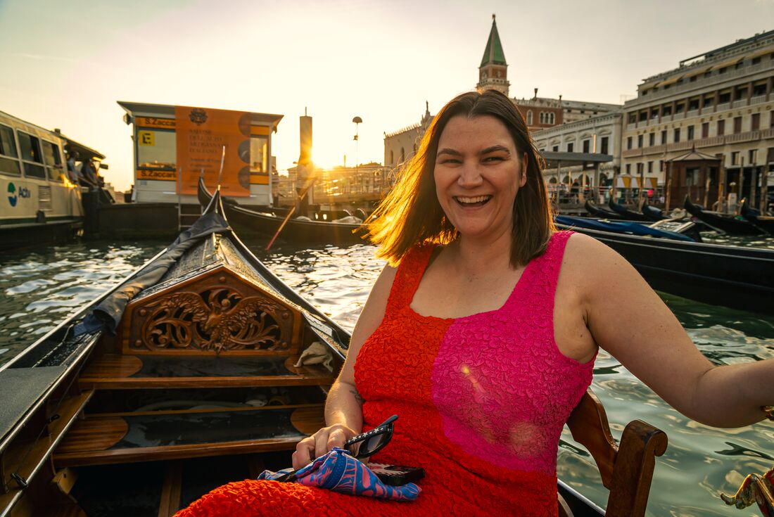 Intrepid traveller Rachel Sarra laughs and smiles during a gondola ride in Venice Italy