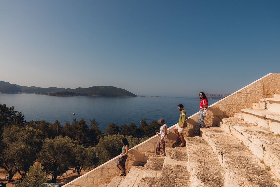 Travellers walking down the steps at the Amphitheathre in Kas, Turkey
