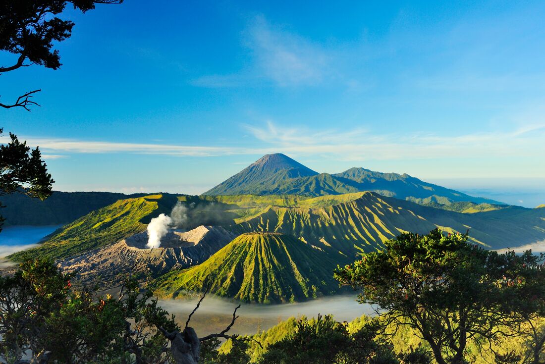 Clear skies and greenery shown in overlooking Mt Bromo in Java, Indonesia